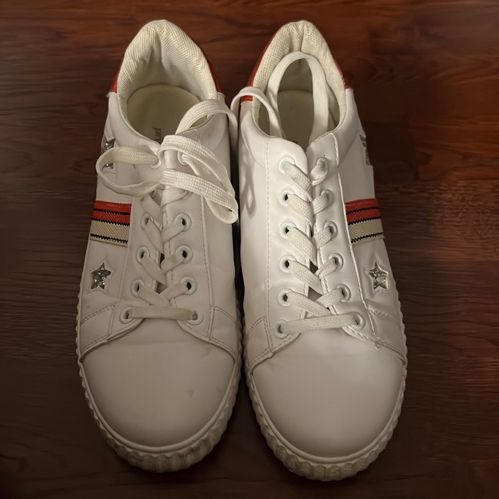 Fashion sneakers. Red and white with silver stars.